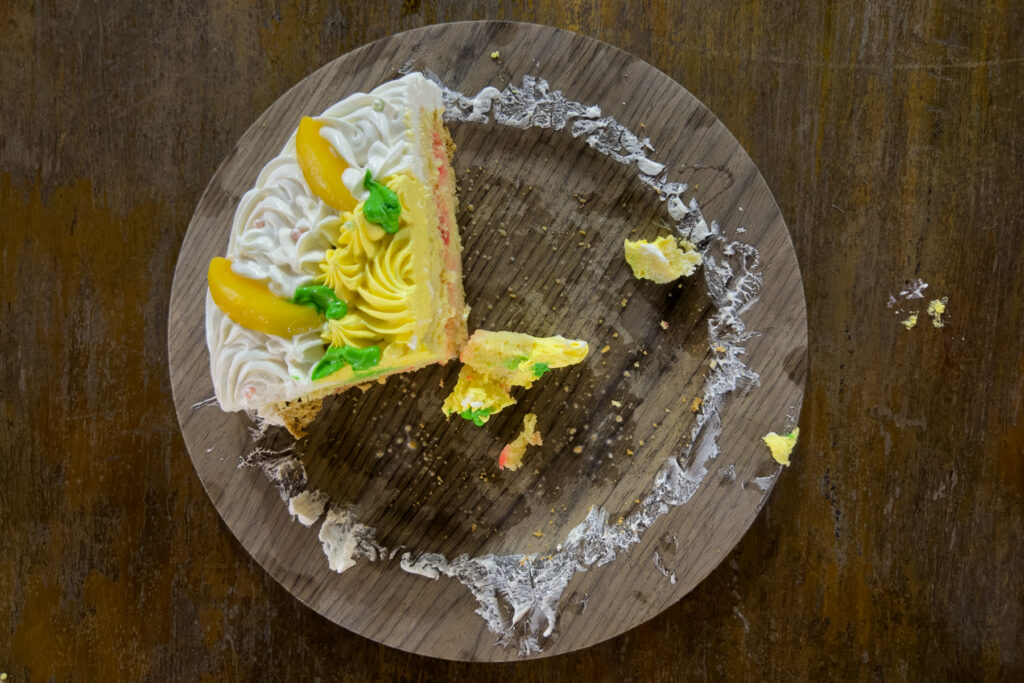 What was left from Linda's Birthday Cake - a delicious sponge with cream and mango icing! (image by Inger Vandyke)