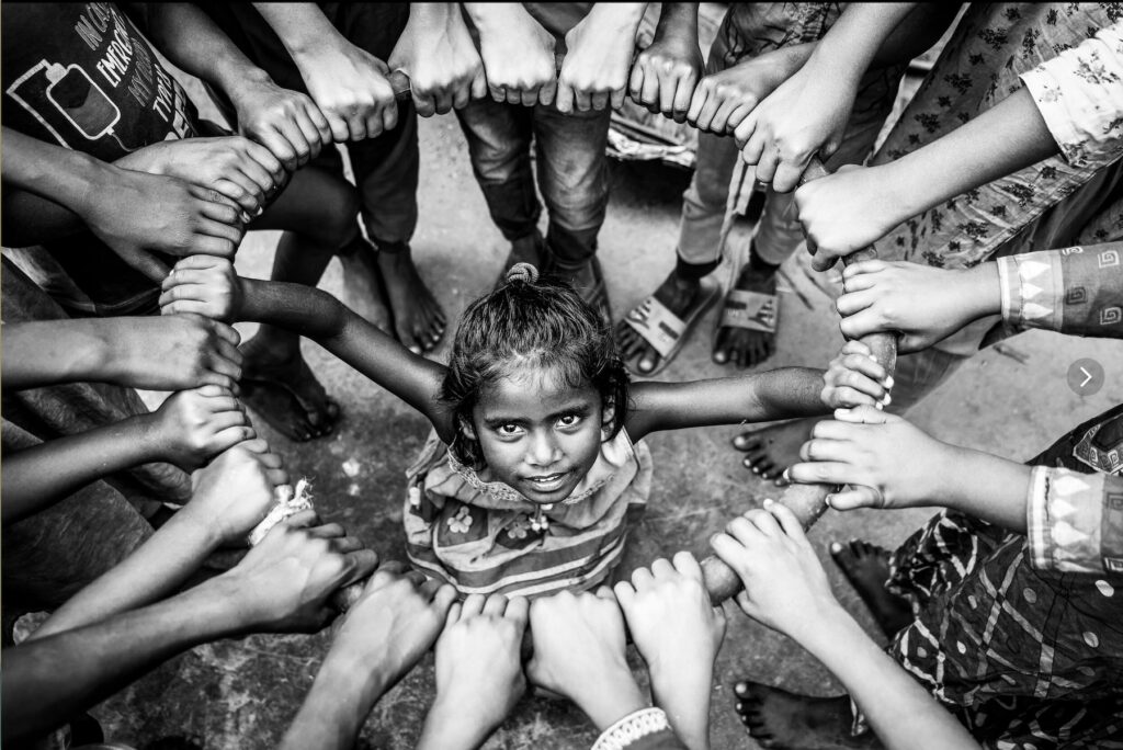 Sandy's award winning image of children in the incredible rice drying courtyards of Bangladesh (image by Sandy Winkle)