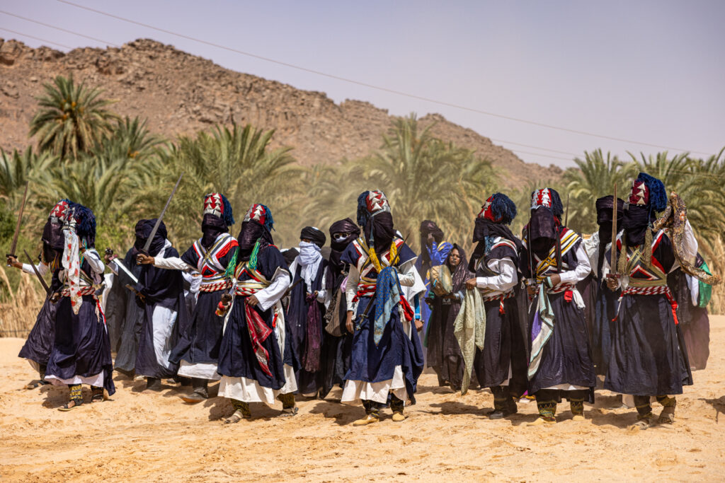 Men and women of the Kel Azjer clan of Tuareg people march in to the annual festival of Sebiba in Djanet (image by Ingrid Koedood)