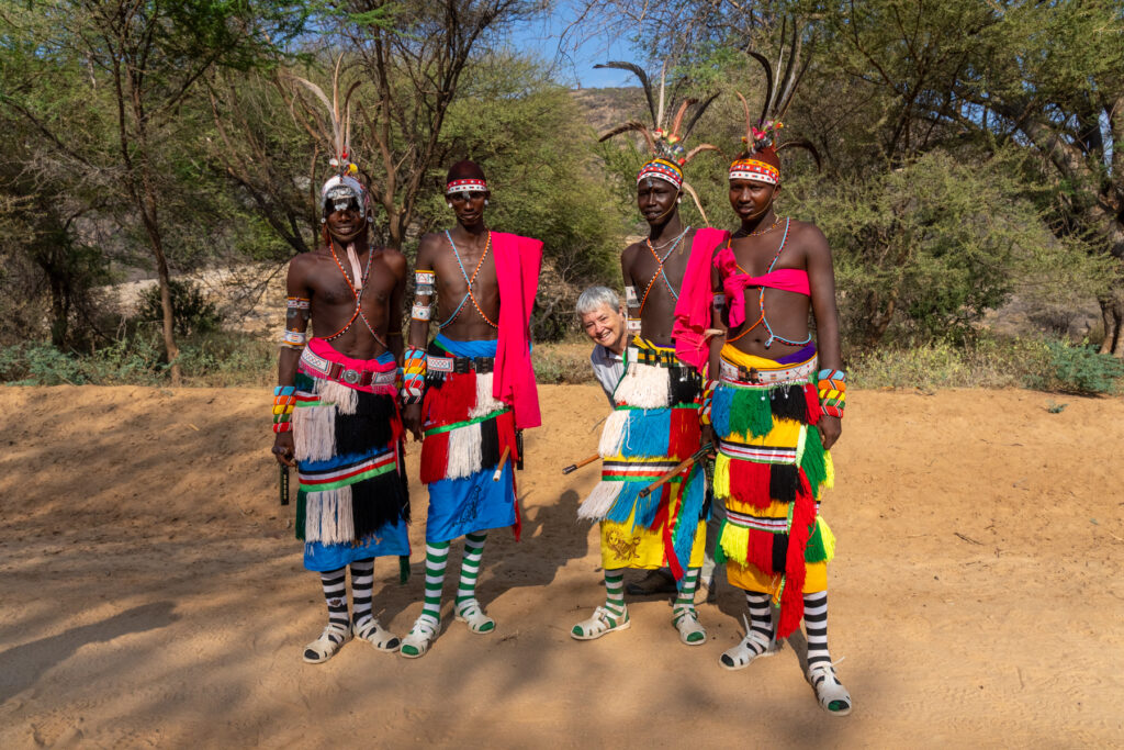 Ann having fun with Rendile morans at the end of our sunrise shoot in the Ndoto Moutains (image by Inger Vandyke)