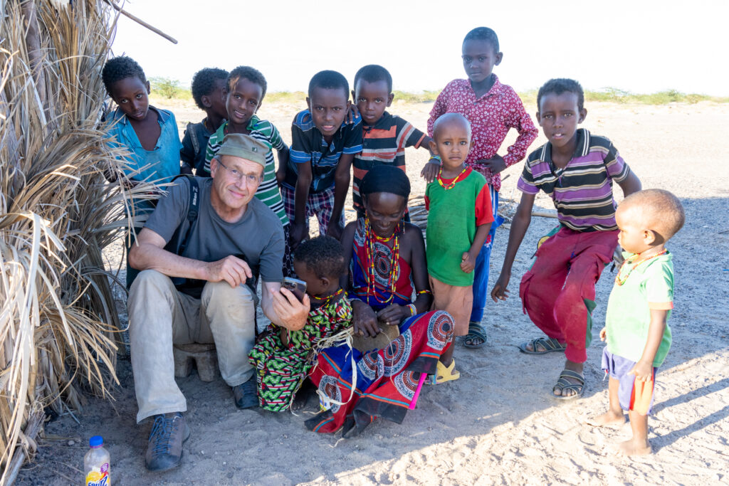 Graham with a group of young Gabra children in the Chalbi Desert of Kenya (image by Inger Vandyke)