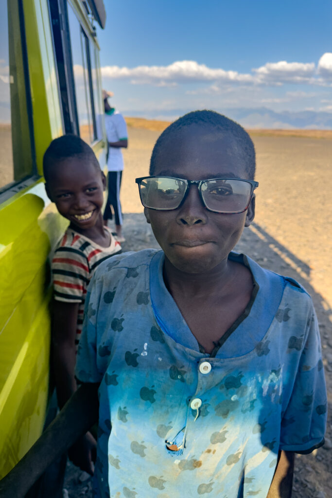 A young Turkana boy comandeers Inger's reading glasses (image by Inger Vandyke)