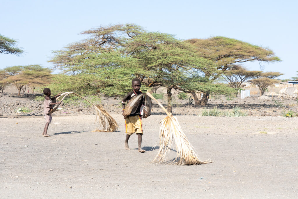 Turkana children playing with toys made from Doum Palm fronds (image by Inger Vandyke)