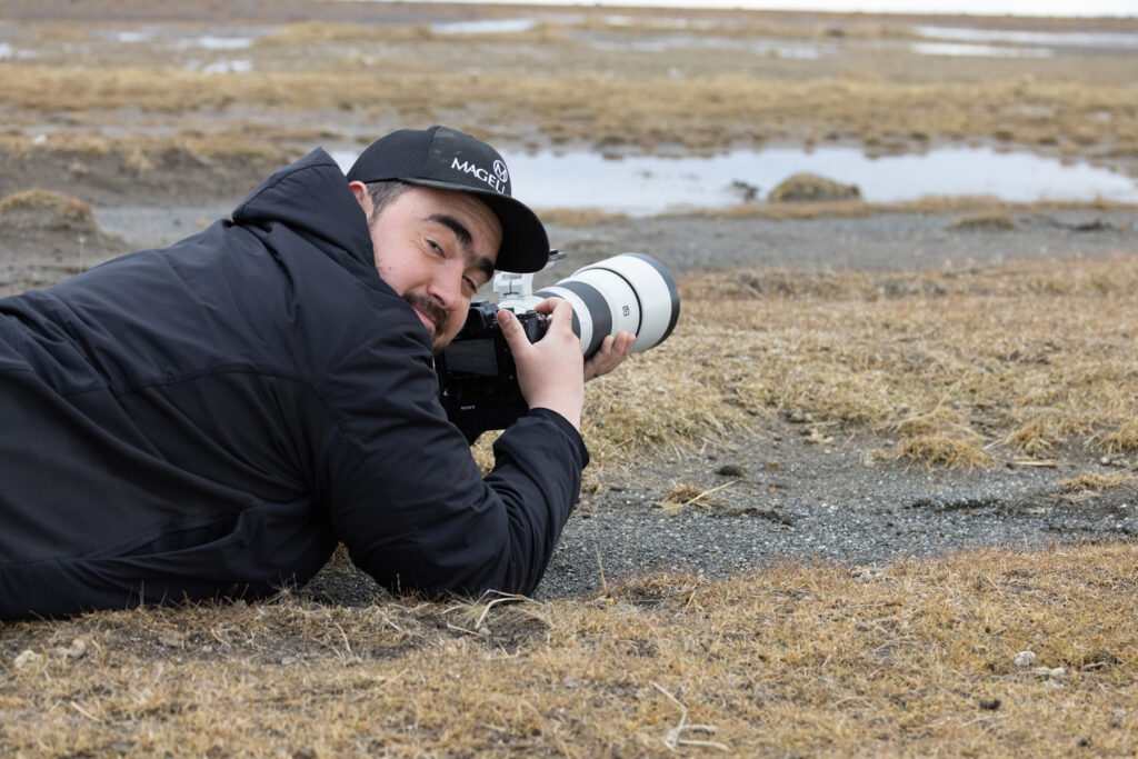 Cristian getting down low for the Magellanic Plover shot (image by Mike Watson)