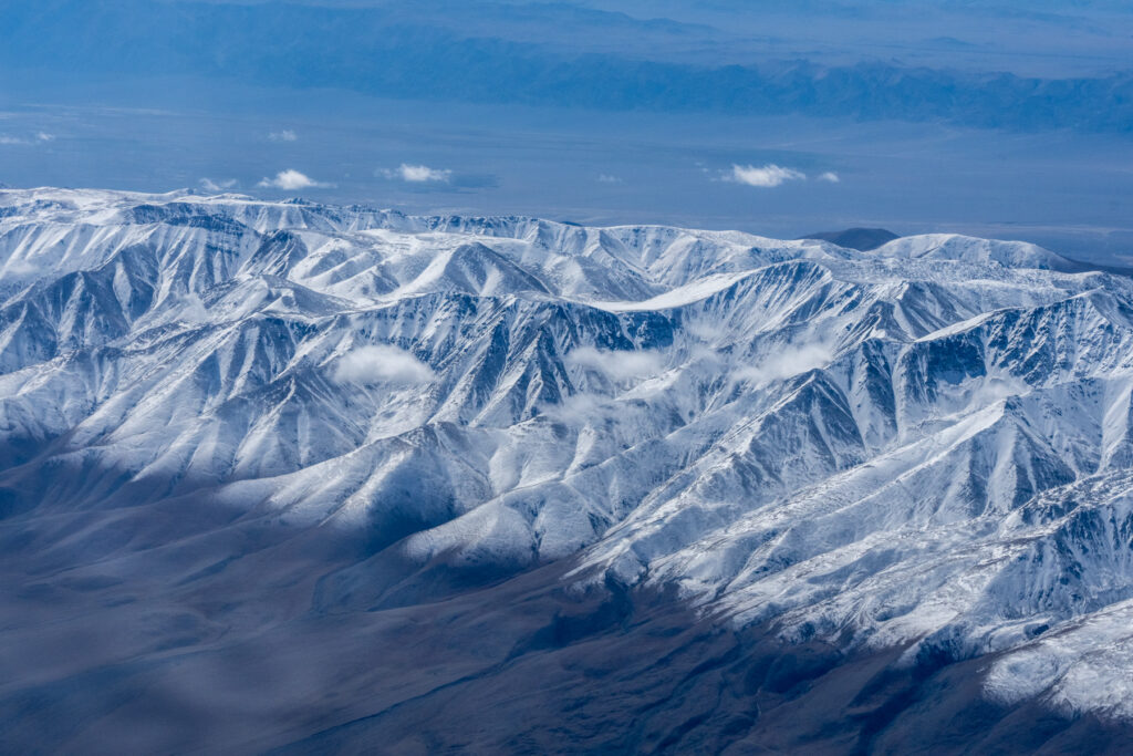 The spectacular, snow-capped peaks of the Jargalant Mountains seen from our flight (image by Inger Vandyke)